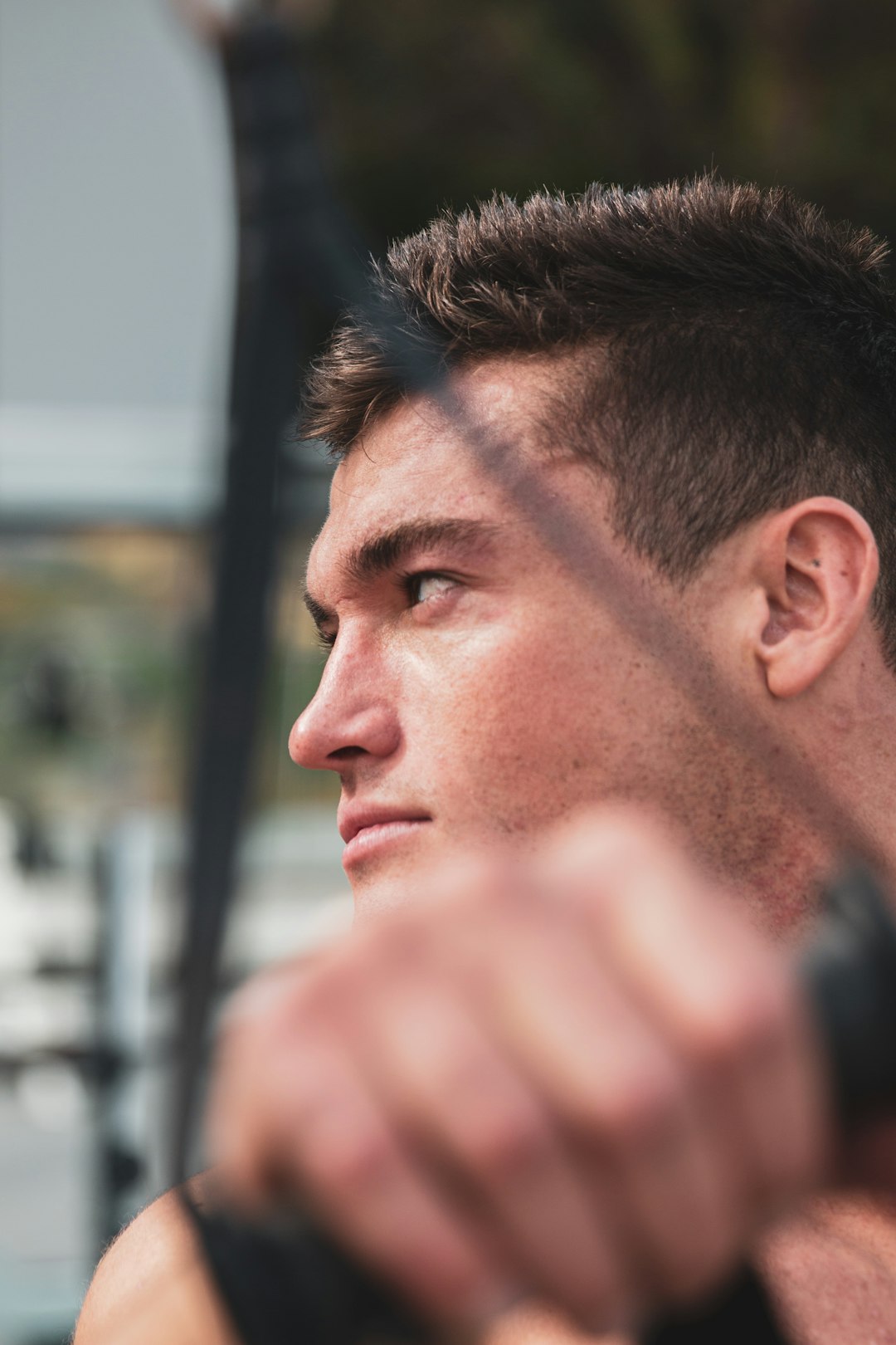 man in black shirt looking down