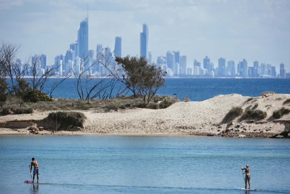 city skyline across blue sea during daytime