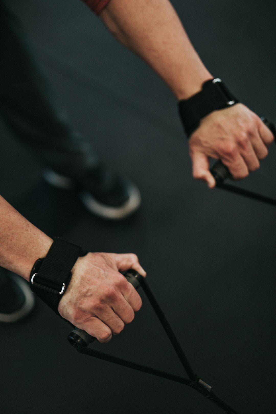 person in black long sleeve shirt wearing black smart watch