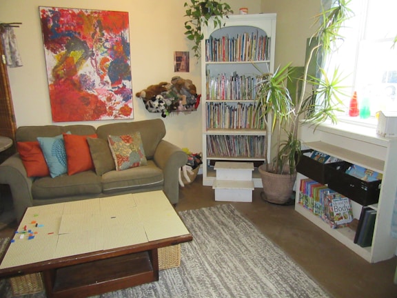 A cozy living room with colorful decor and toys.