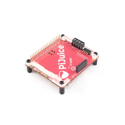 A red electronic circuit board labeled 'PiJuice' with various connectors and pins. It has four black legs to elevate it off a surface and contains several black components and gold pins.
