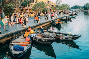 people riding on boat on river during daytime