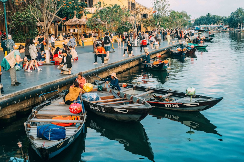 people riding on boat on river during daytime