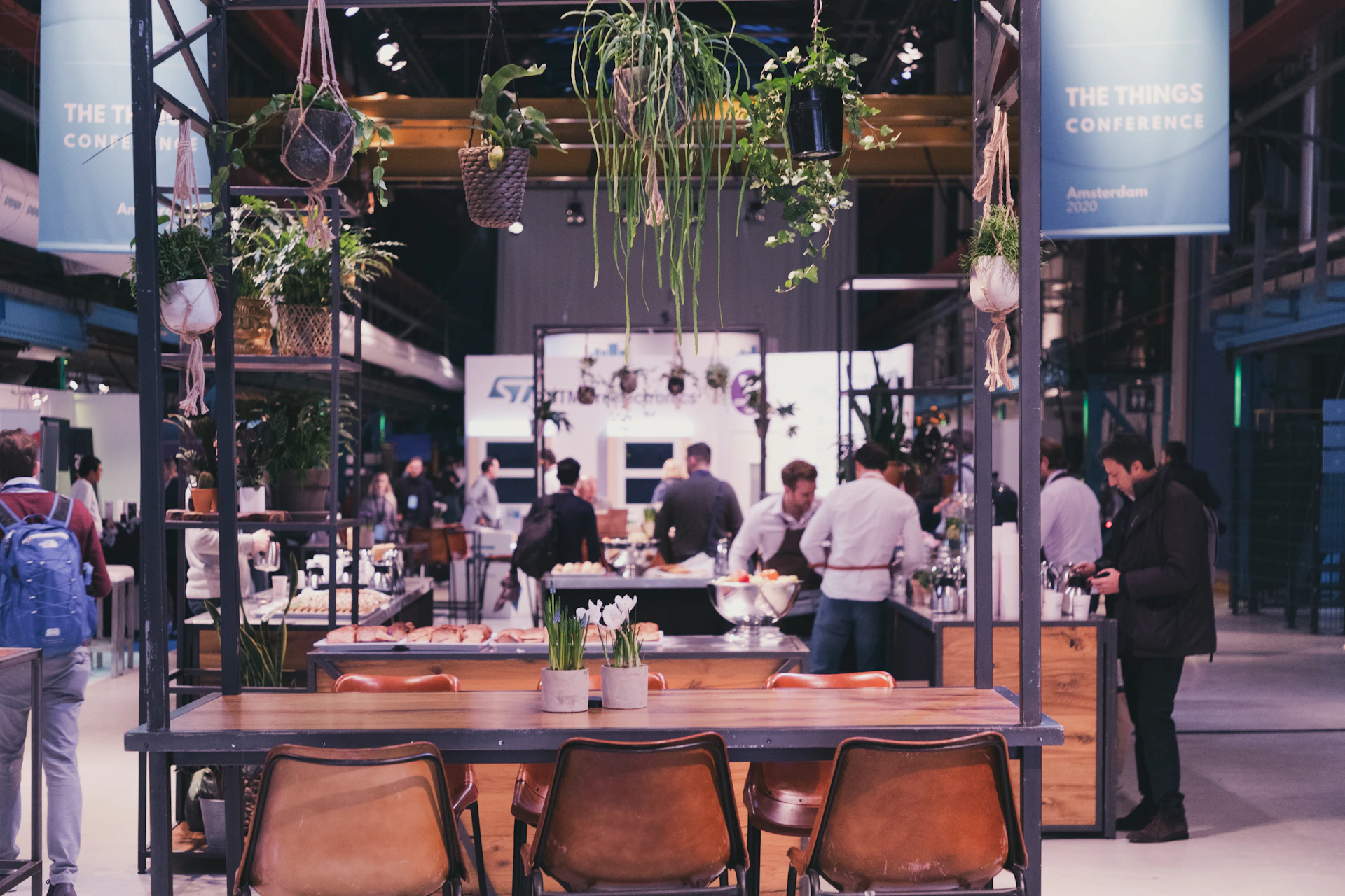 people standing and sitting at the table