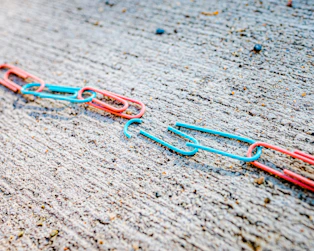 blue green and red plastic clothes pin