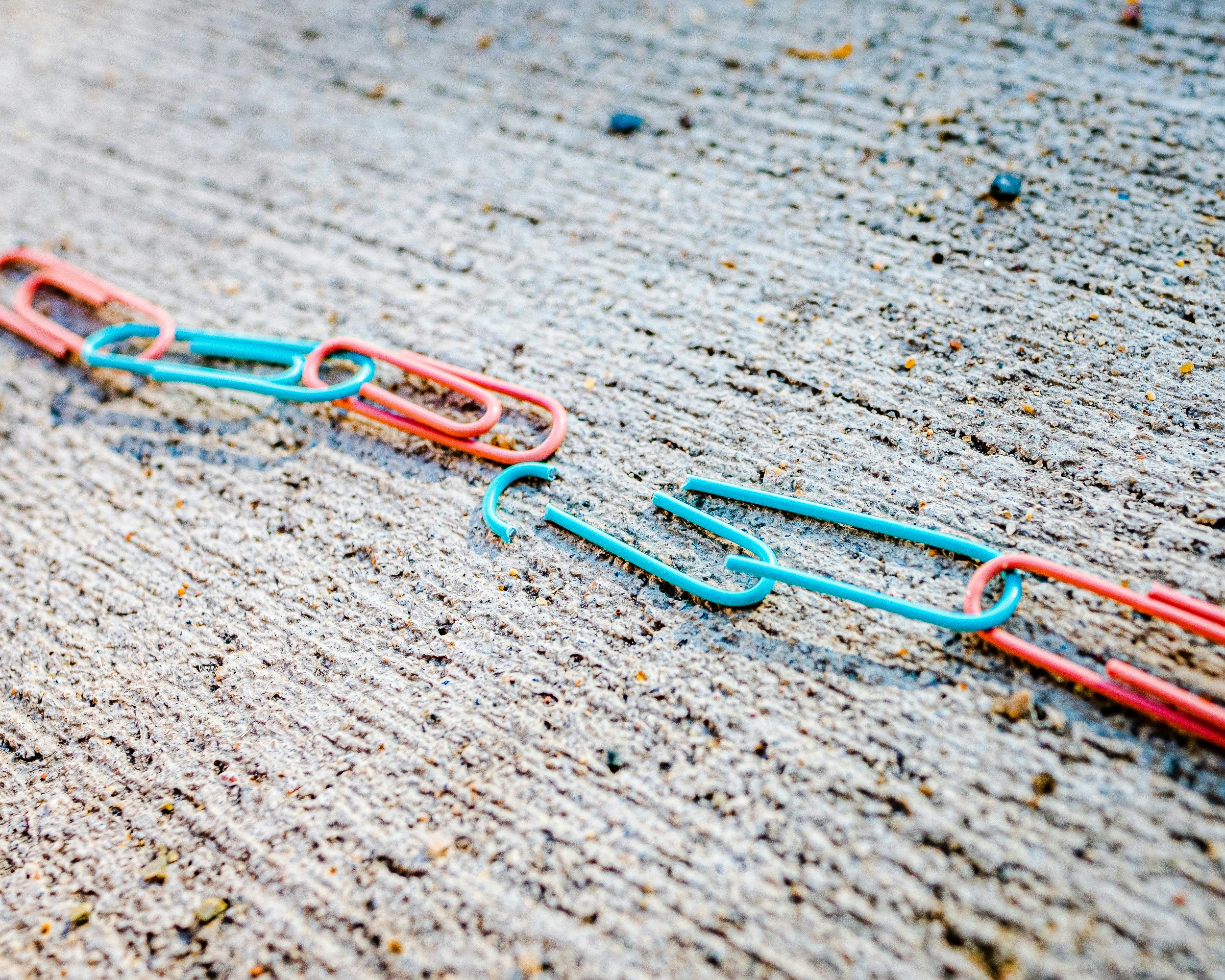 blue green and red plastic clothes pin
