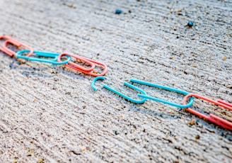 blue green and red plastic clothes pin