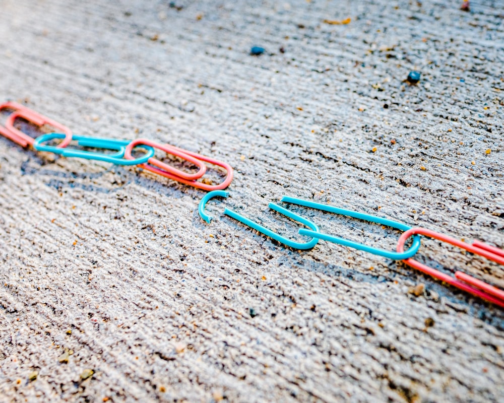 blue green and red plastic clothes pin