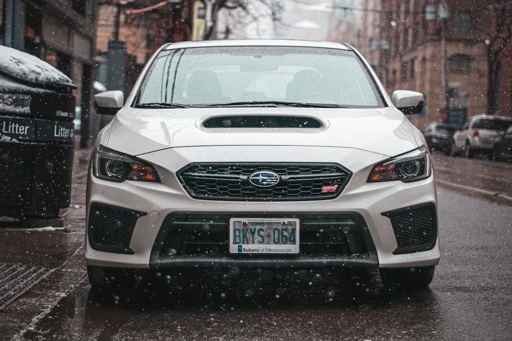 white chevrolet car on road during daytime