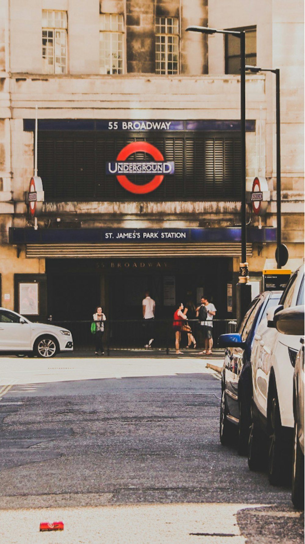 cars parked in front of building during daytime