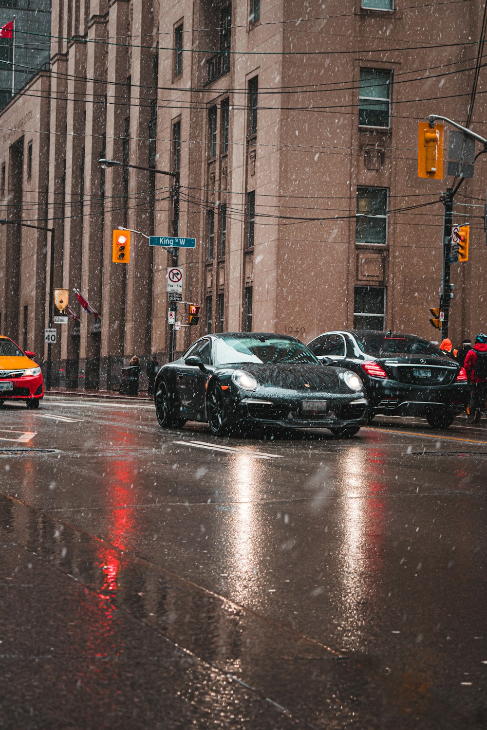 black sedan on road during daytime