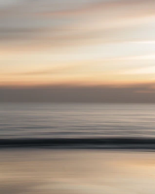 body of water during sunset