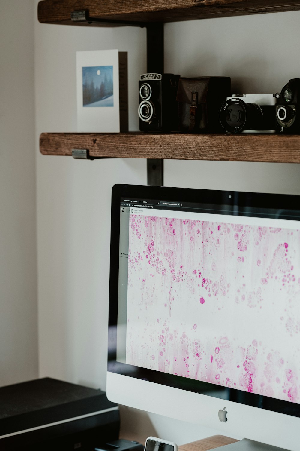 black flat screen tv on brown wooden tv rack