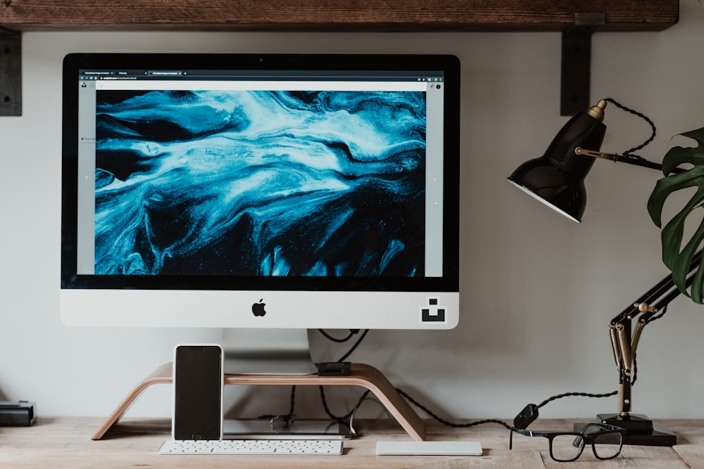 silver imac on white table