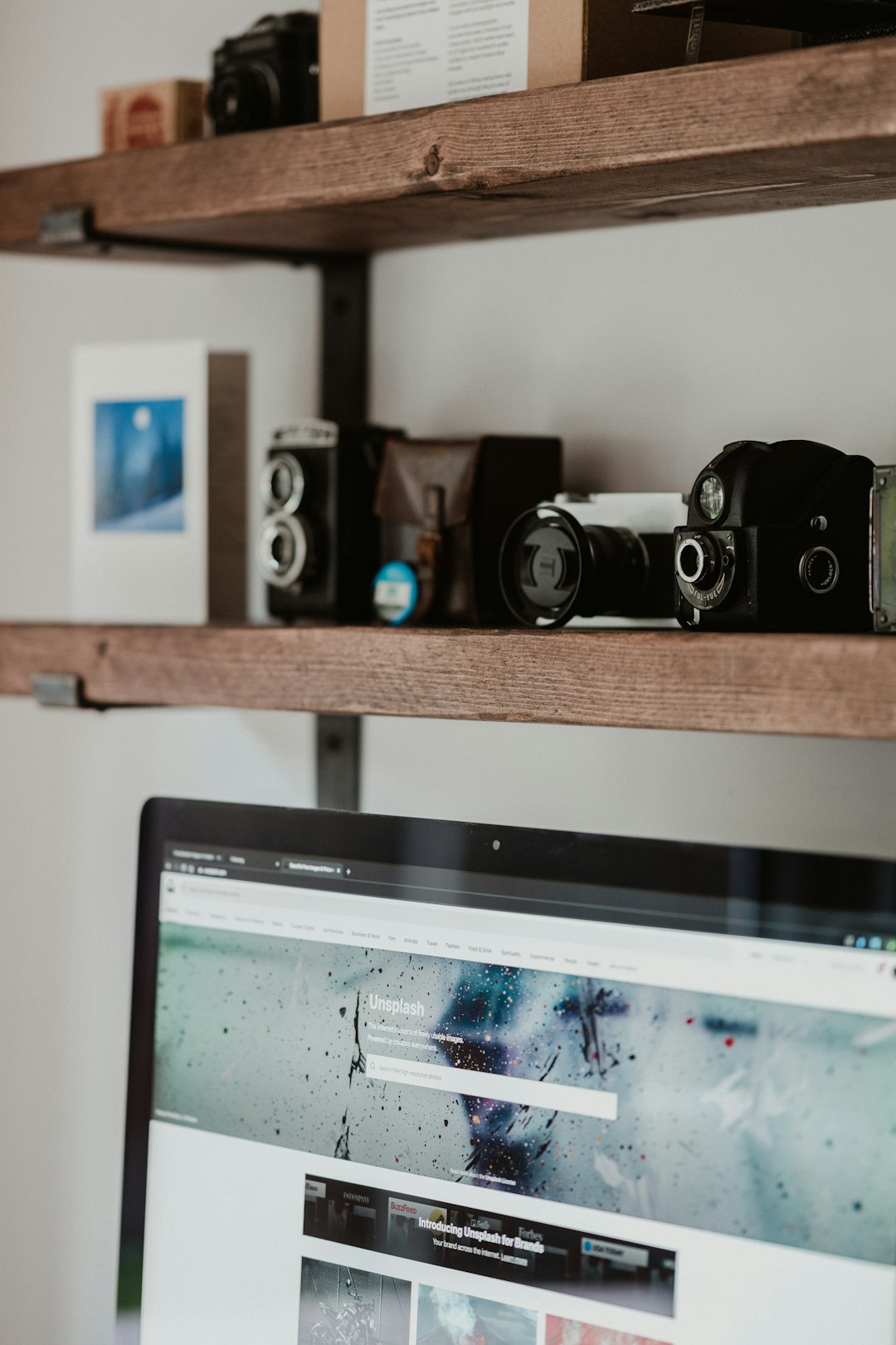 black flat screen computer monitor beside black and silver speakers