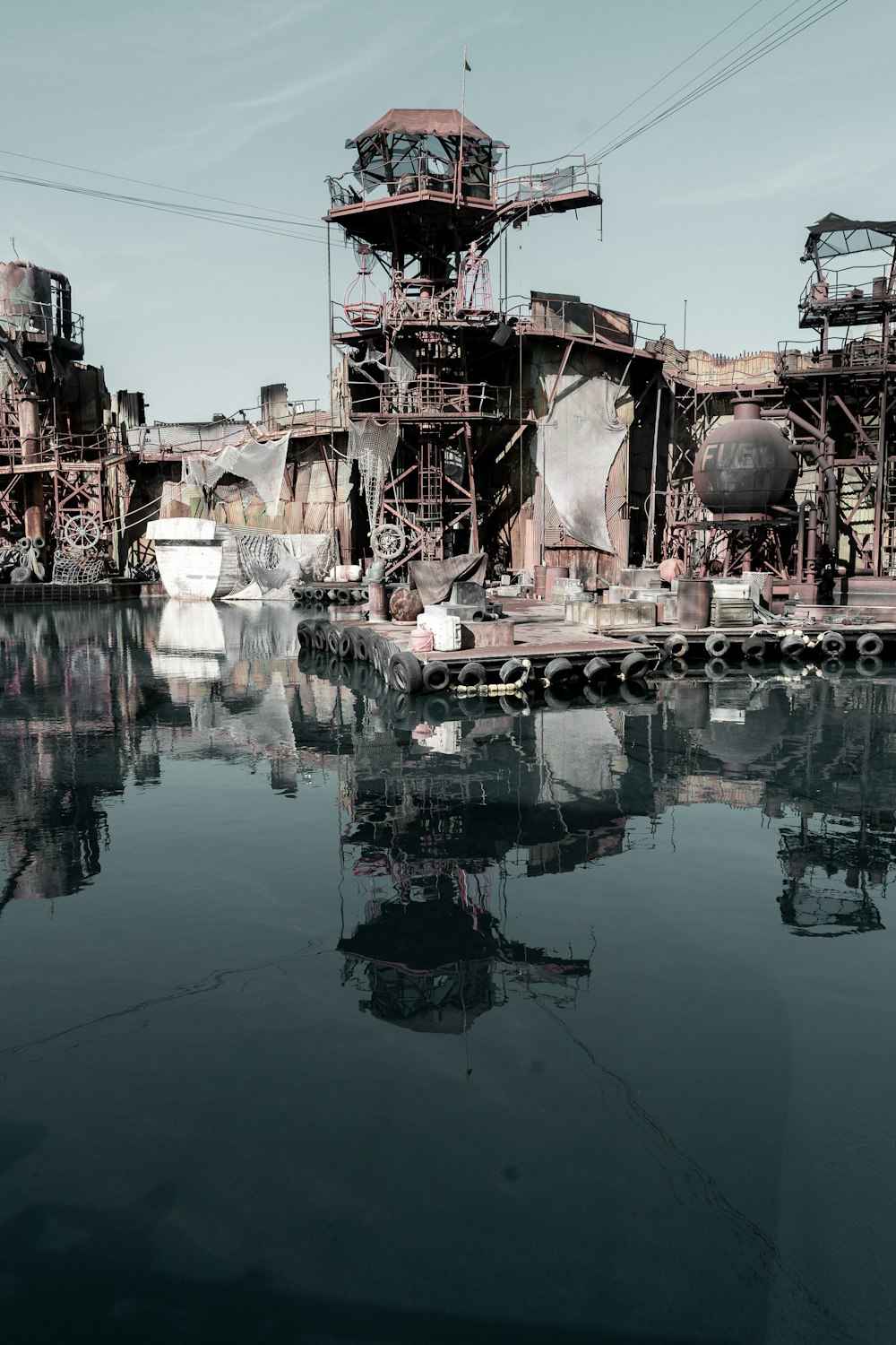 brown and white concrete building near body of water during daytime