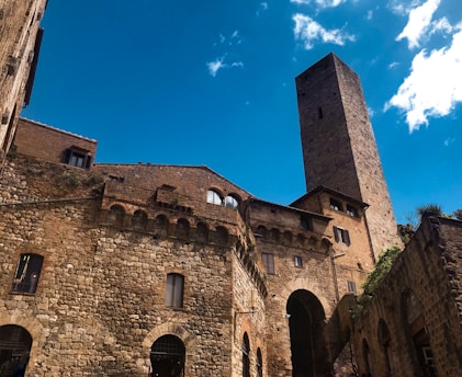 brown brick building under blue sky