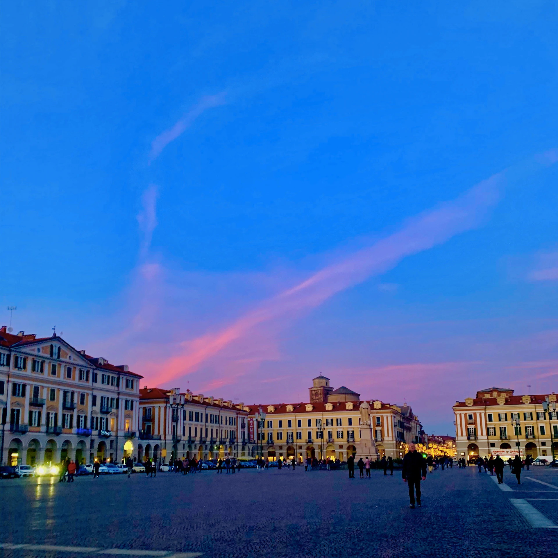 woman wearing yellow long-sleeved dress under white clouds and blue sky during daytime