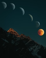 brown rocky mountain under blue sky during night time
