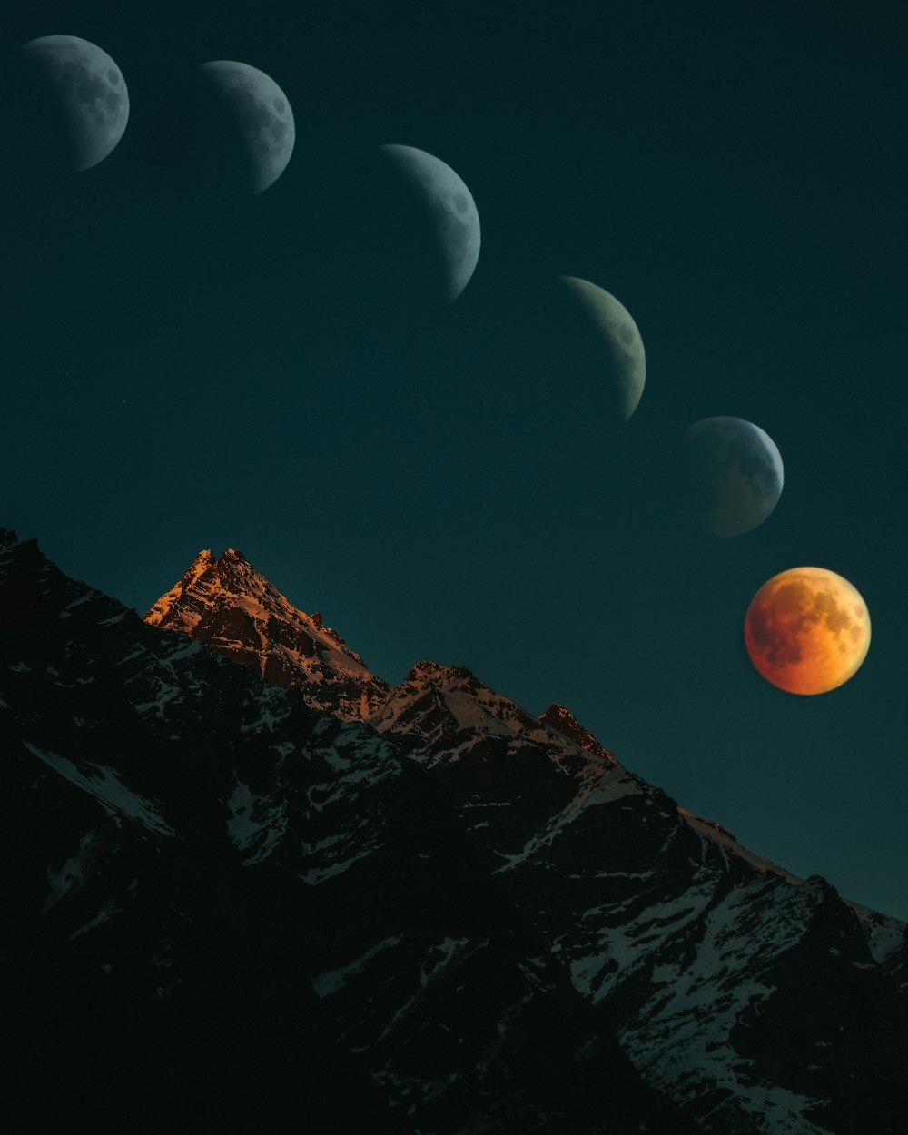 brown rocky mountain under blue sky during night time