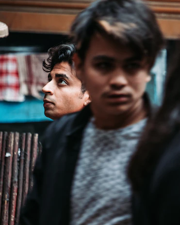 Young men participating in a mentorship workshop, focused and inspired.