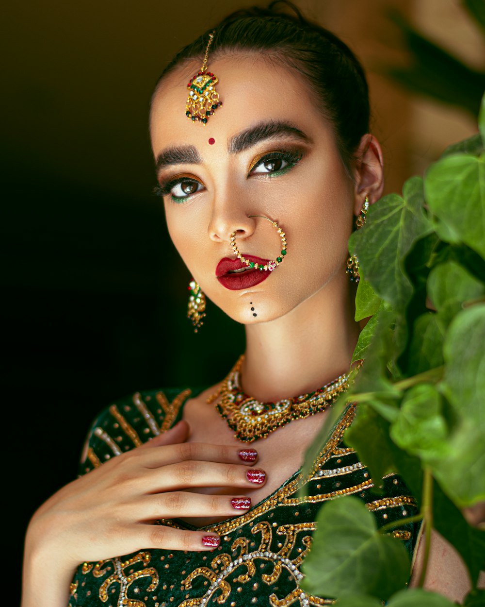 woman in yellow and black dress with gold necklace