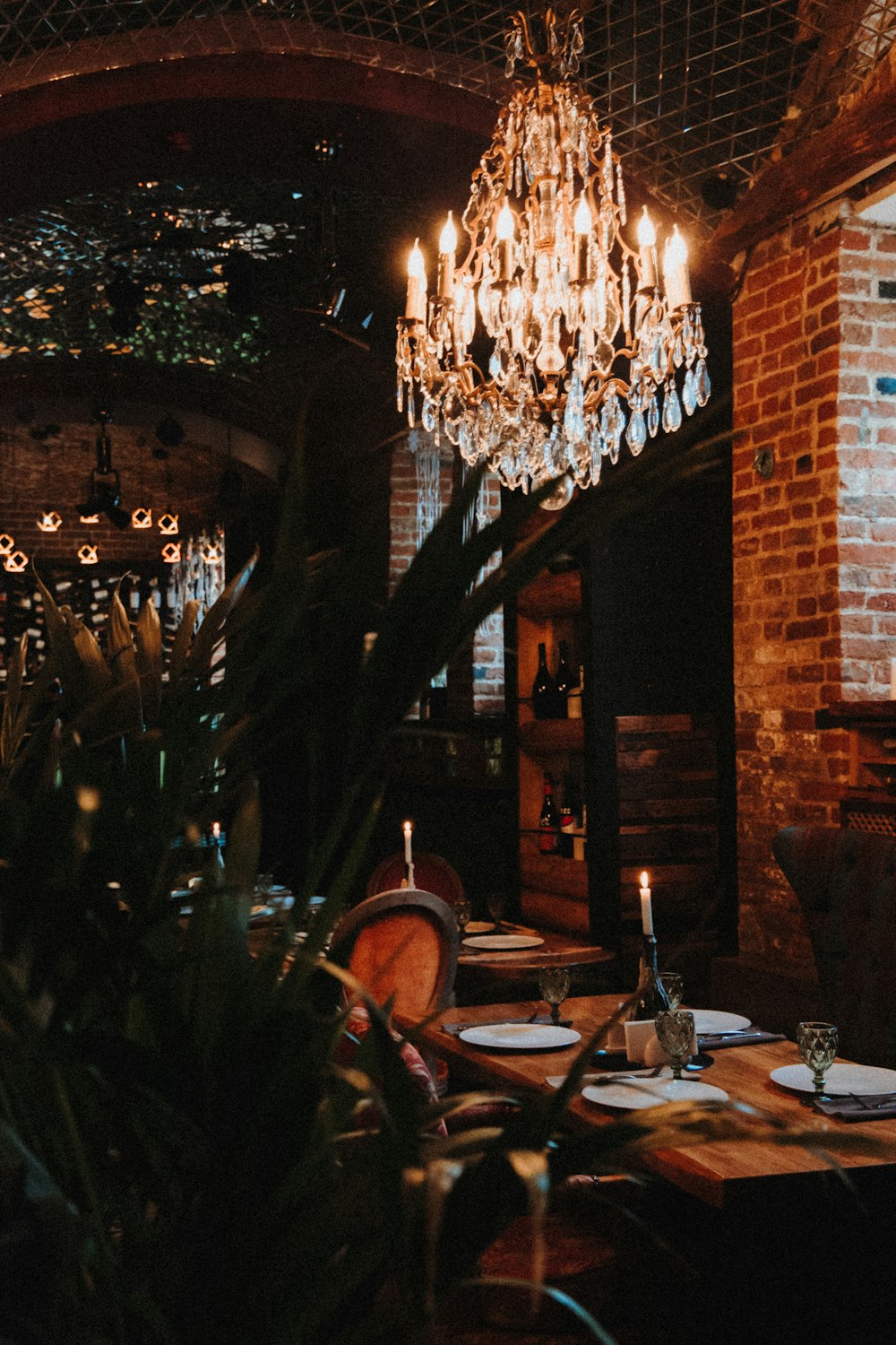 lighted string lights on brown brick wall