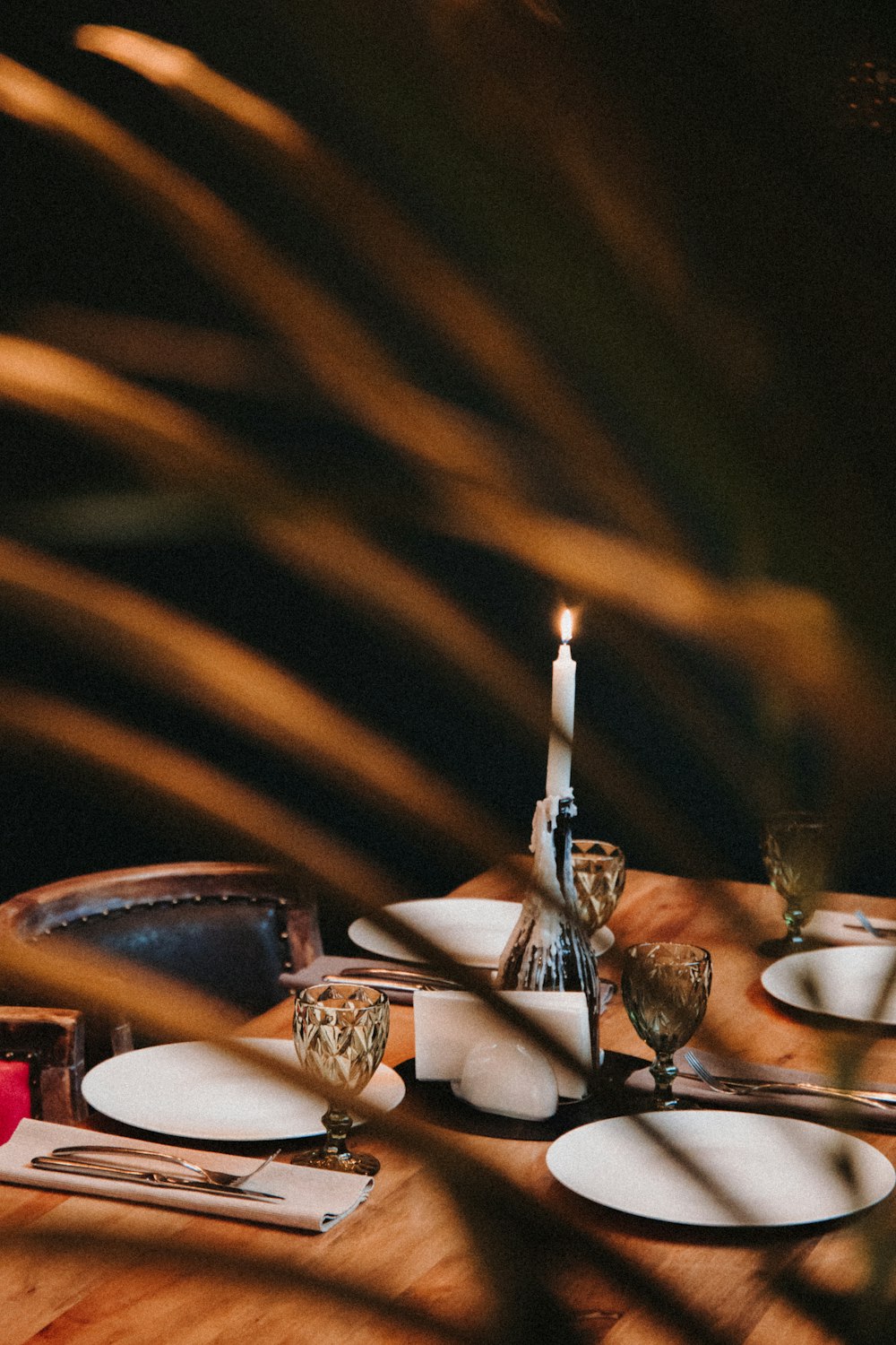 lighted candles on table with candles