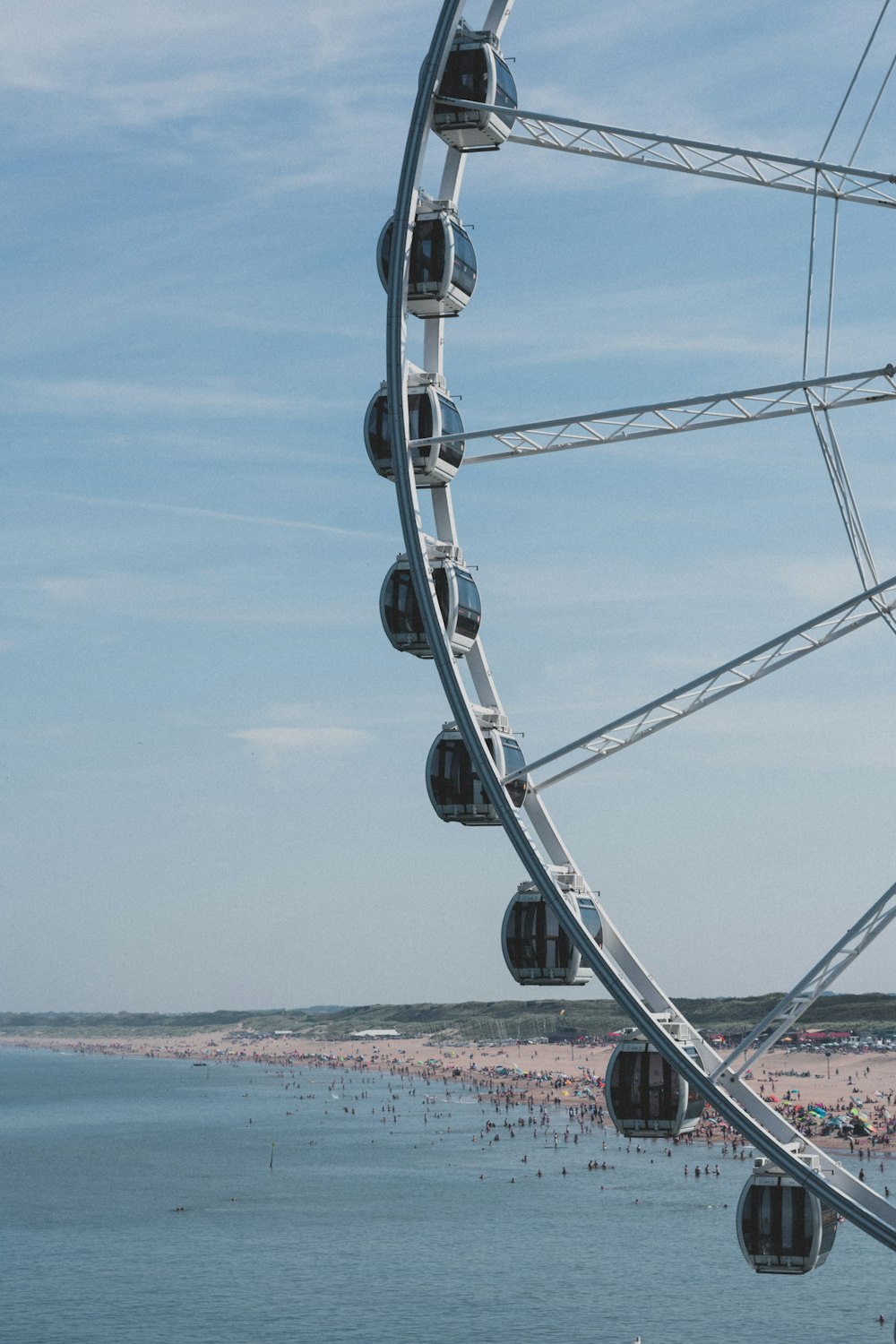 gray metal frame near sea during daytime