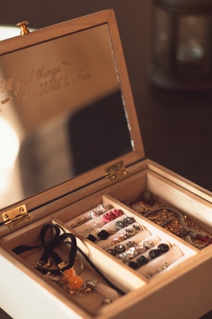 brown wooden chest box with gold and silver coins