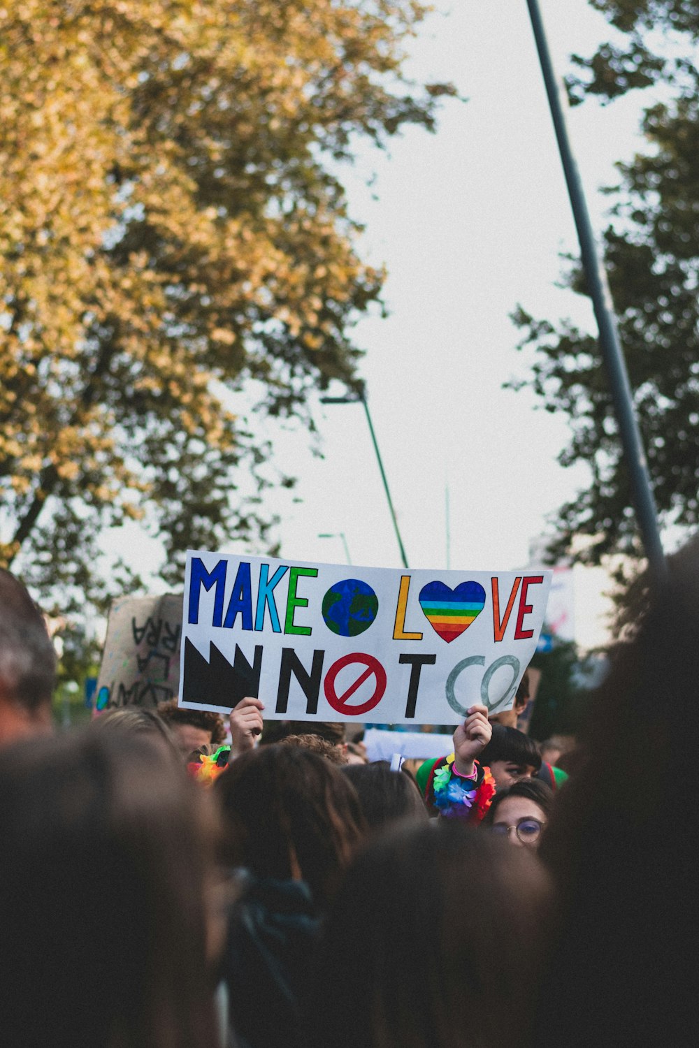 people holding blue and white UNK banner during daytime