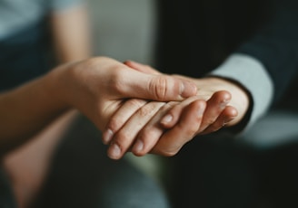 person holding babys hand