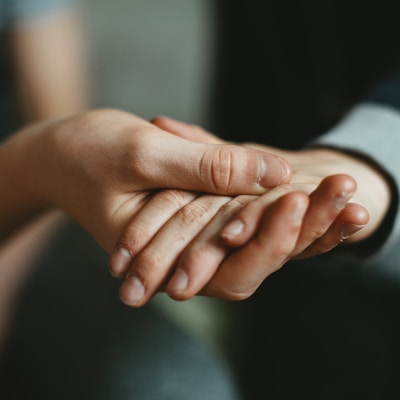 person holding babys hand