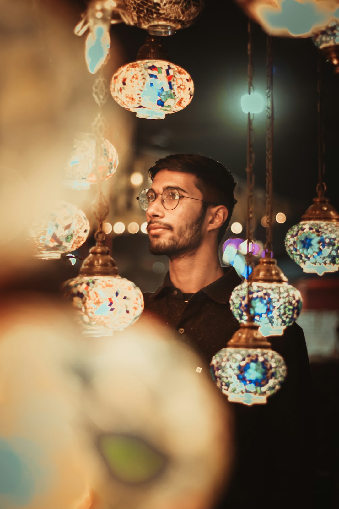 man in black crew neck shirt wearing eyeglasses