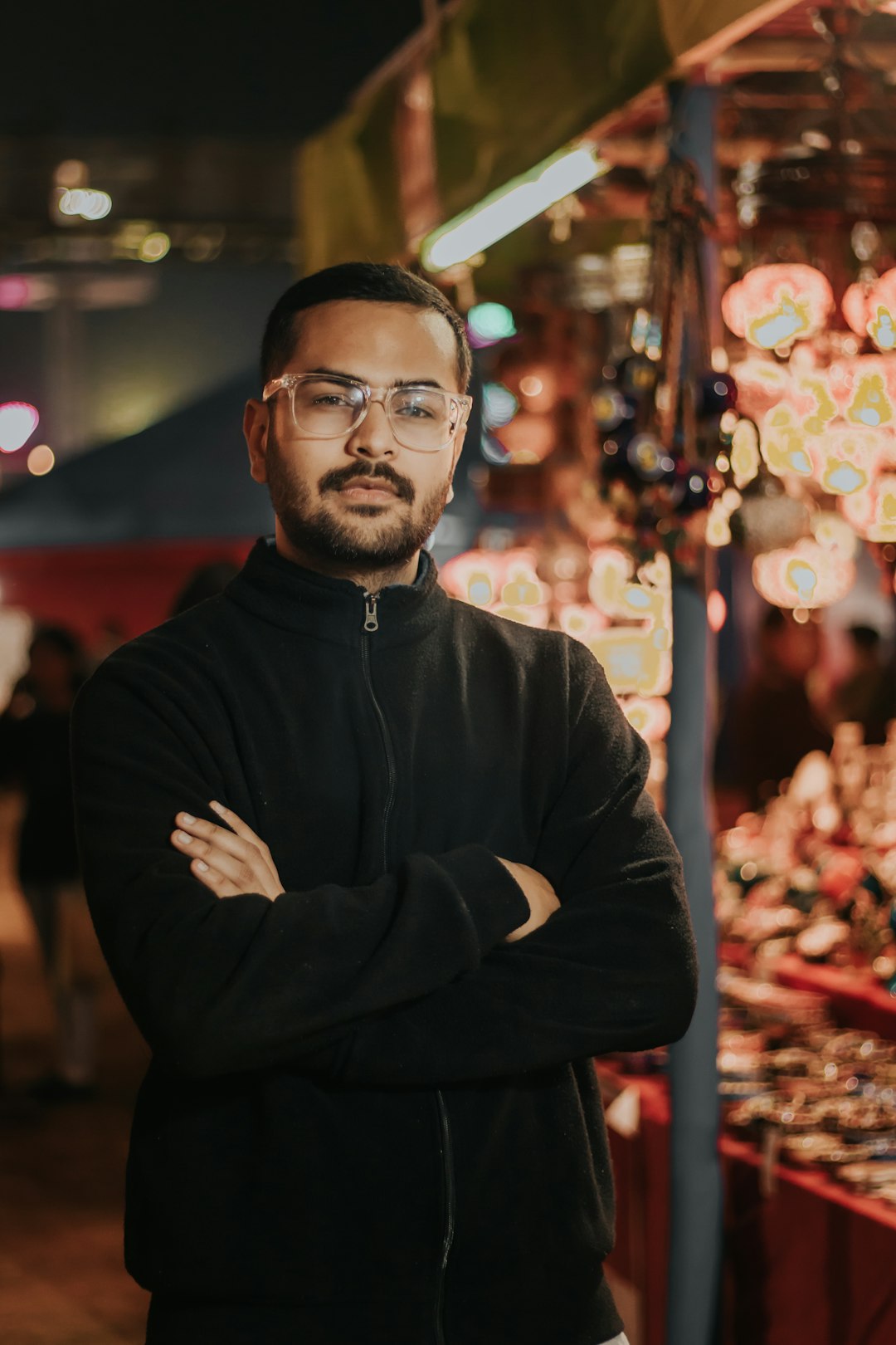 man in black jacket wearing eyeglasses