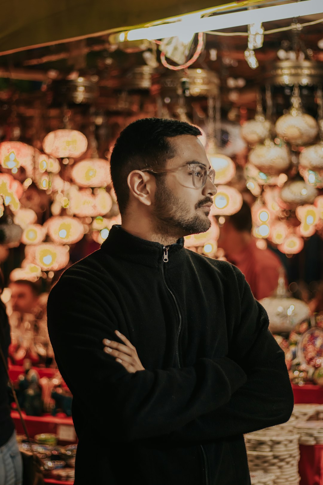 man in black jacket wearing eyeglasses