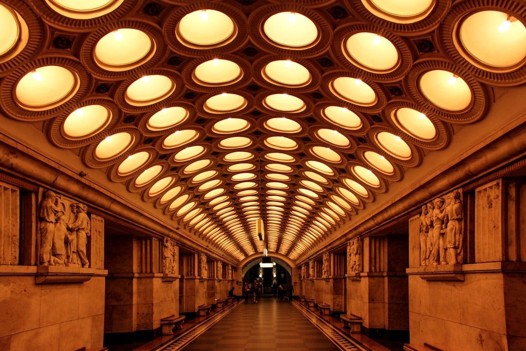 white and brown hallway with lights turned on during daytime
