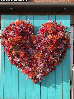 Close-up of heart-shaped flowers arranged beautifully on a beach backdrop.