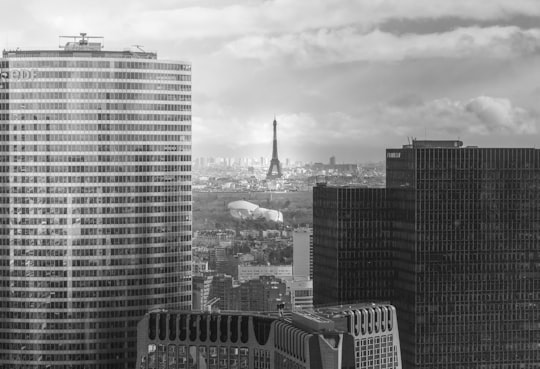 grayscale photo of city buildings in Grande Arche de la Defense France