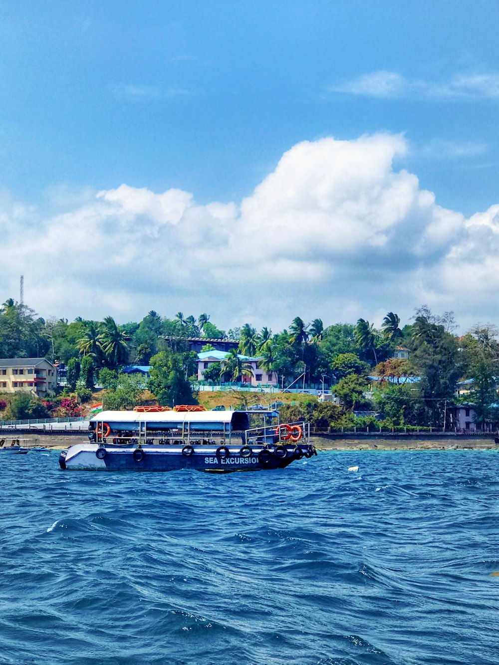 white and black boat on body of water during daytime