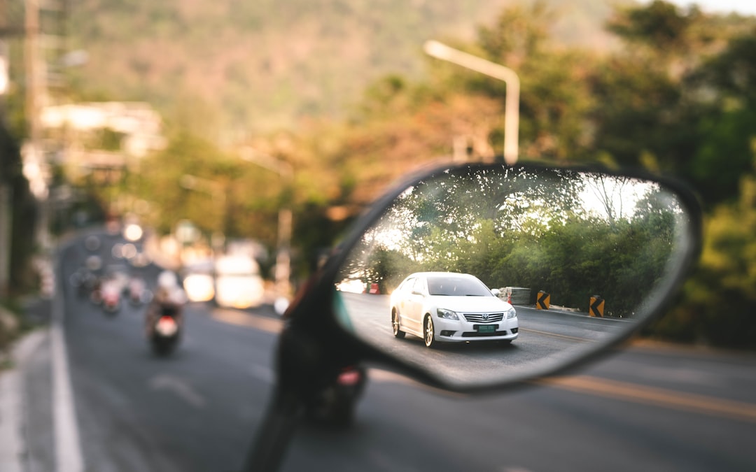 white car on road during daytime