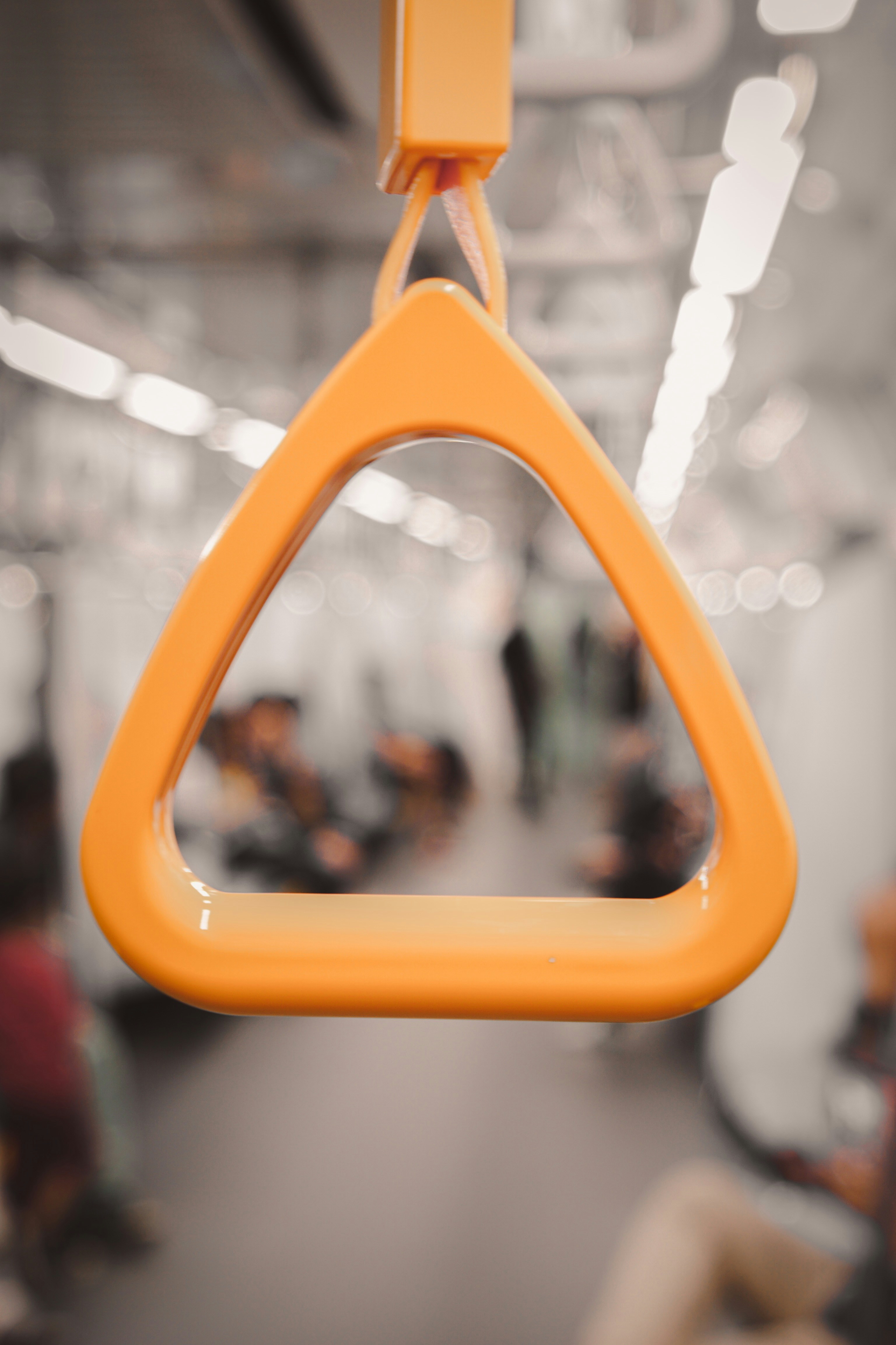person holding yellow framed mirror