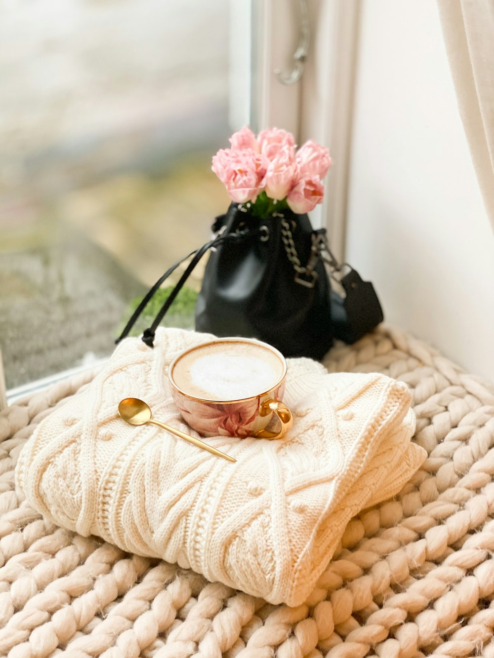 gold ring on white knit textile