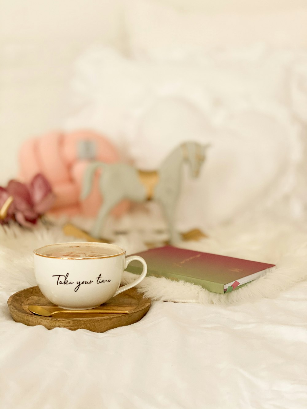 white ceramic teacup on saucer