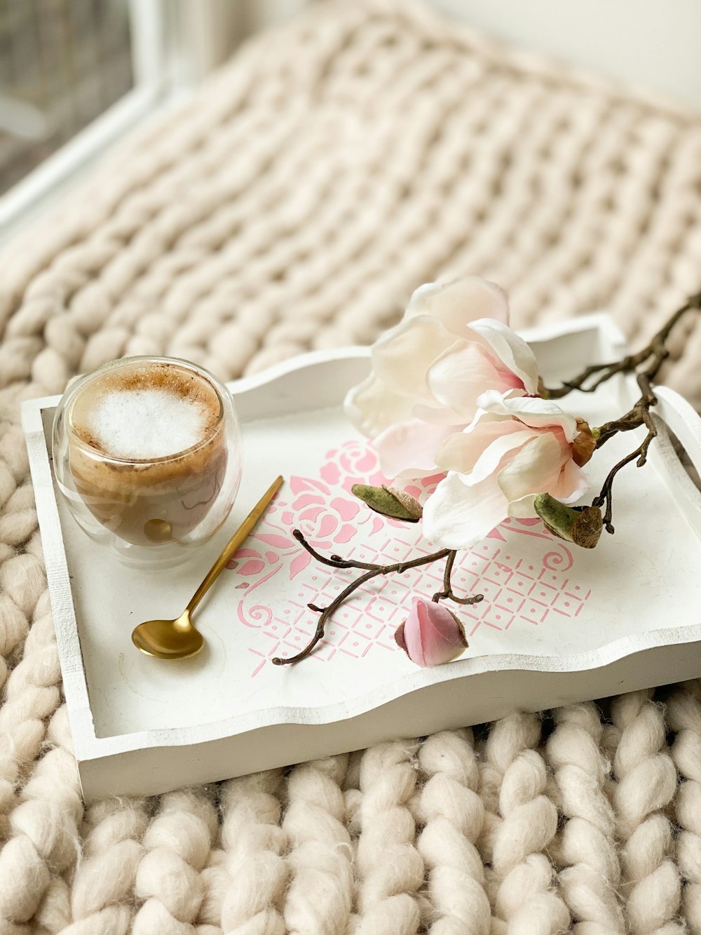 clear glass cup on white ceramic saucer