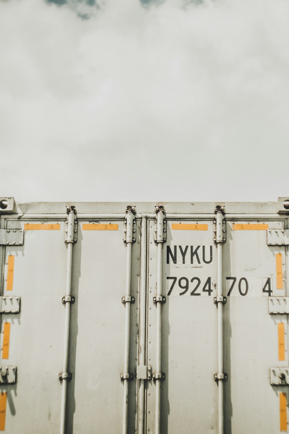 white and brown steel containers