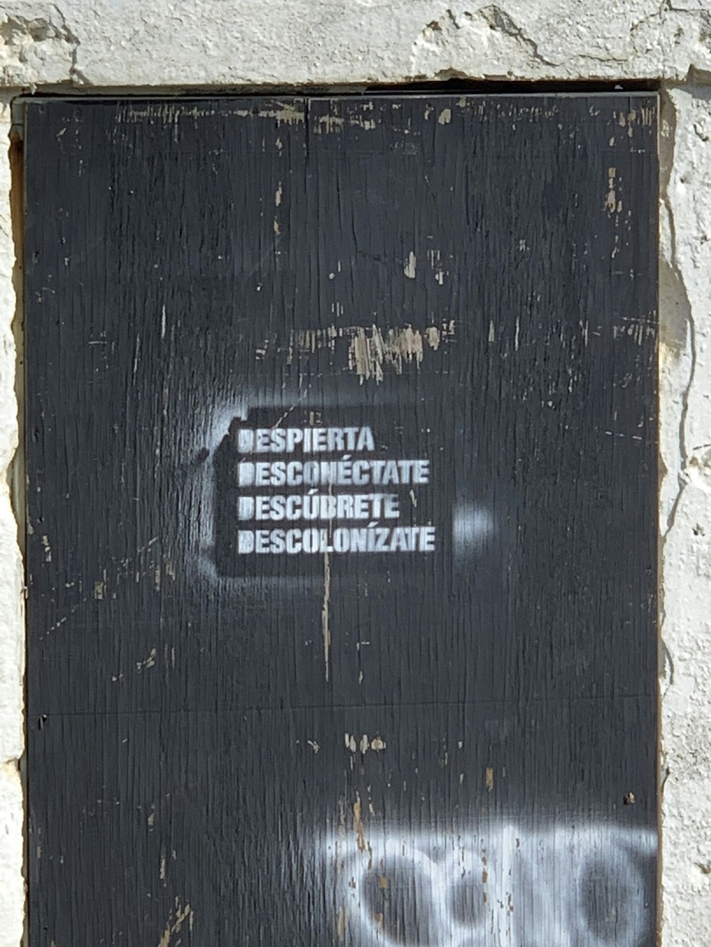 black wooden door with white text