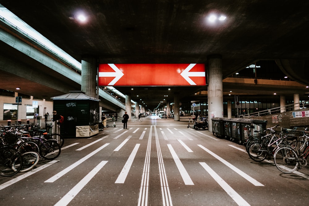 people walking on pedestrian lane during night time