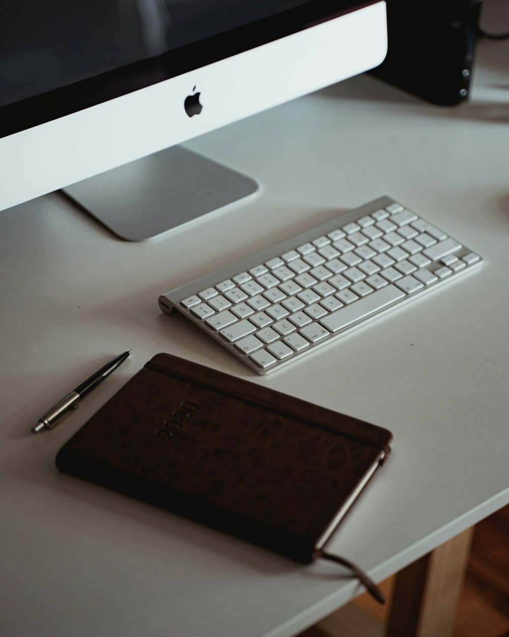 silver imac and apple keyboard