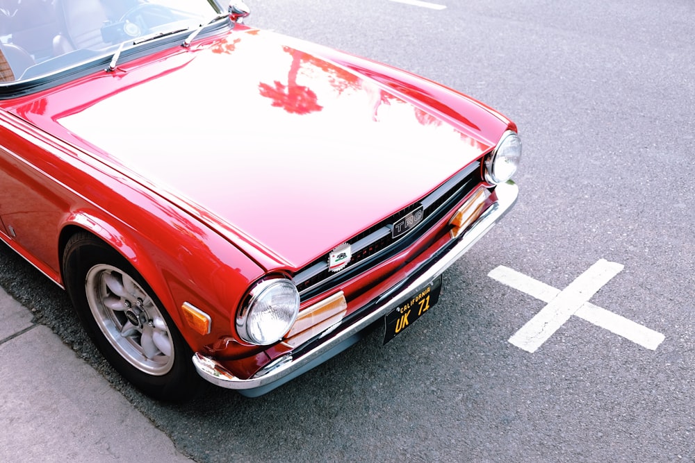 red mercedes benz car on road during daytime